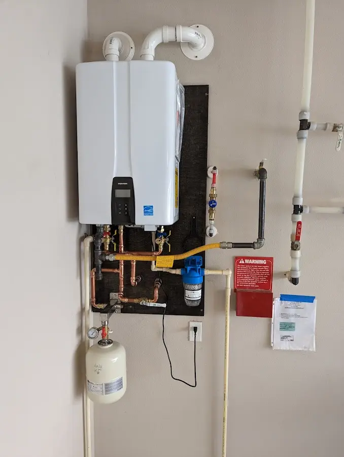 Professional plumber installing copper piping in a Cherryland home